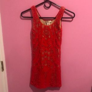 Tight, red Arden B dress with cut out designs